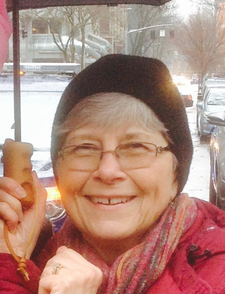 louise neilson in hat and scarf with snow in the background